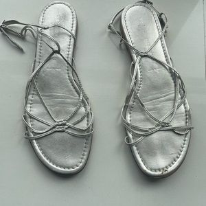 Silver sandals. Delicate straps.  Worn a couple of times.